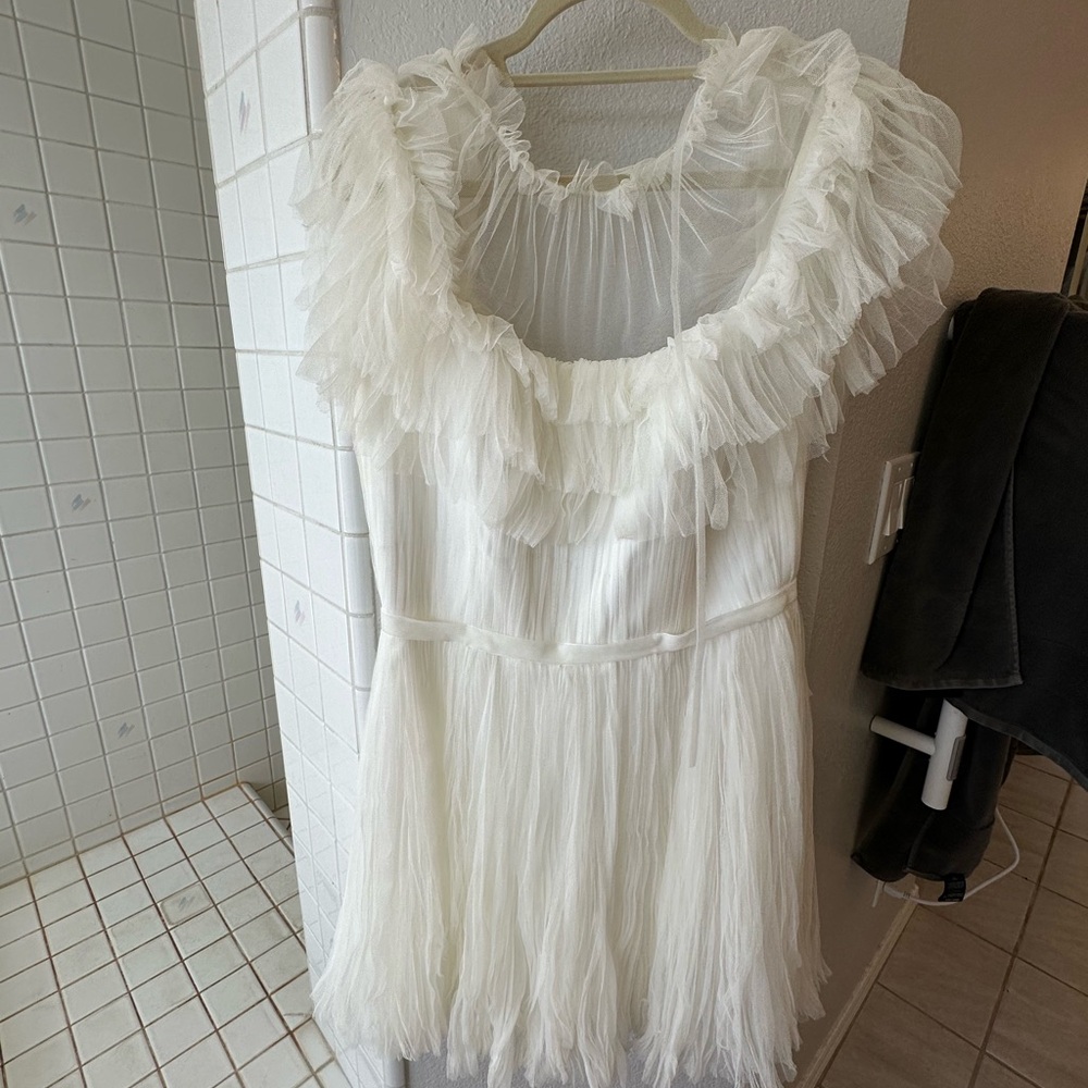 Sway- pleated soft netting together to create ruffles & movement that is Sway.